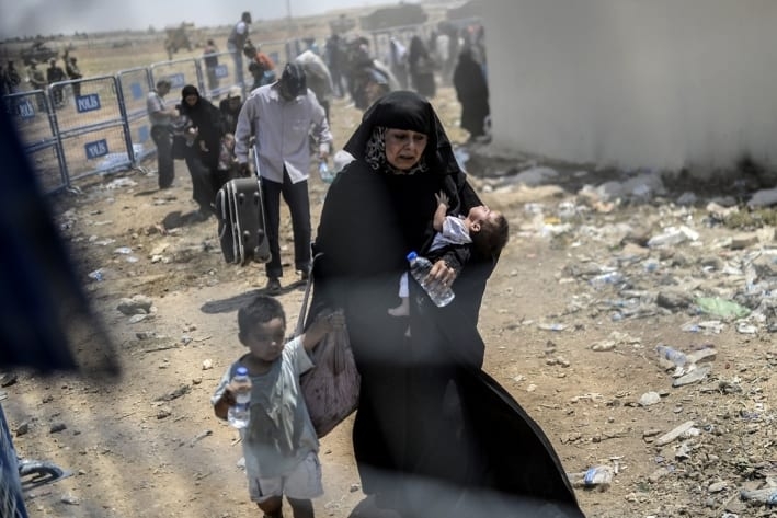 Refugiats sirians arribant a Turquia (FOTO Bulent Kilic AFP Mirades)